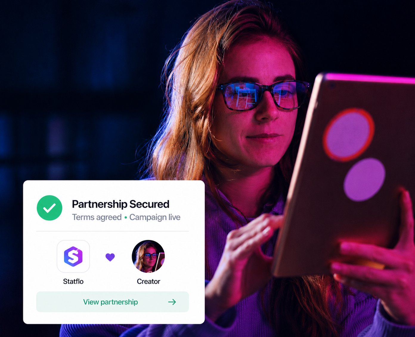 A creator viewing a secured partnership confirmation on a tablet.